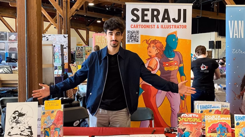 Man at table with comics
