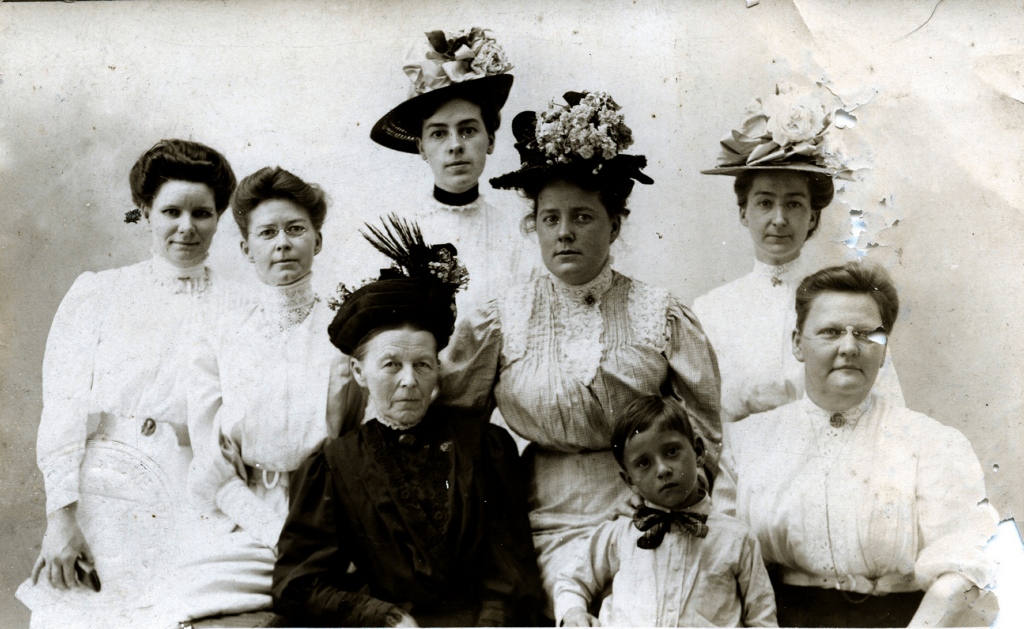 Vintage photo of women in Victorian outfits.