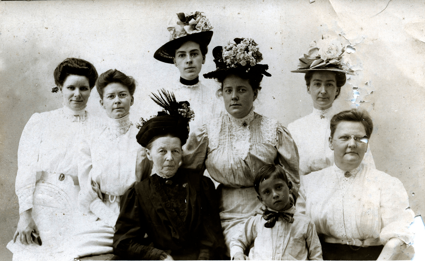 Vintage photo of women in Victorian outfits.