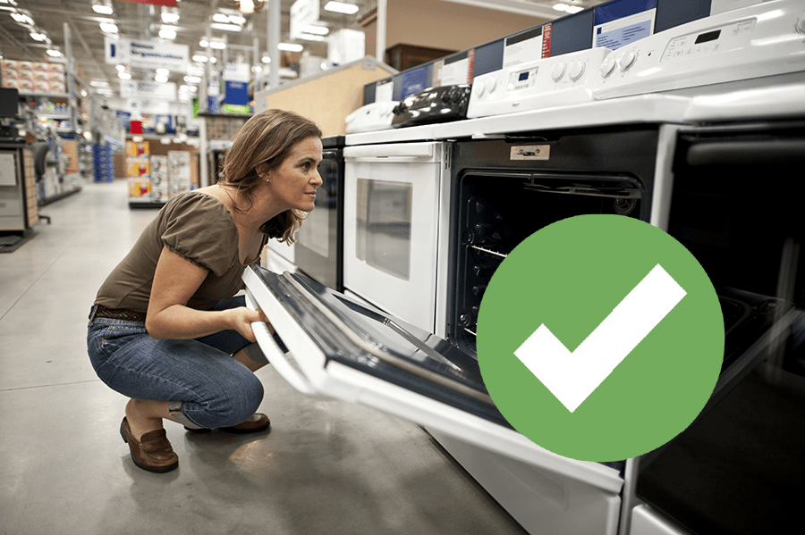 woman looking inside oven
