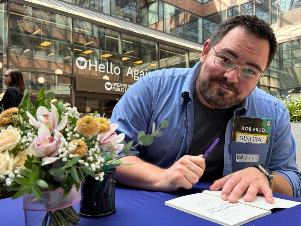 Local author signing book