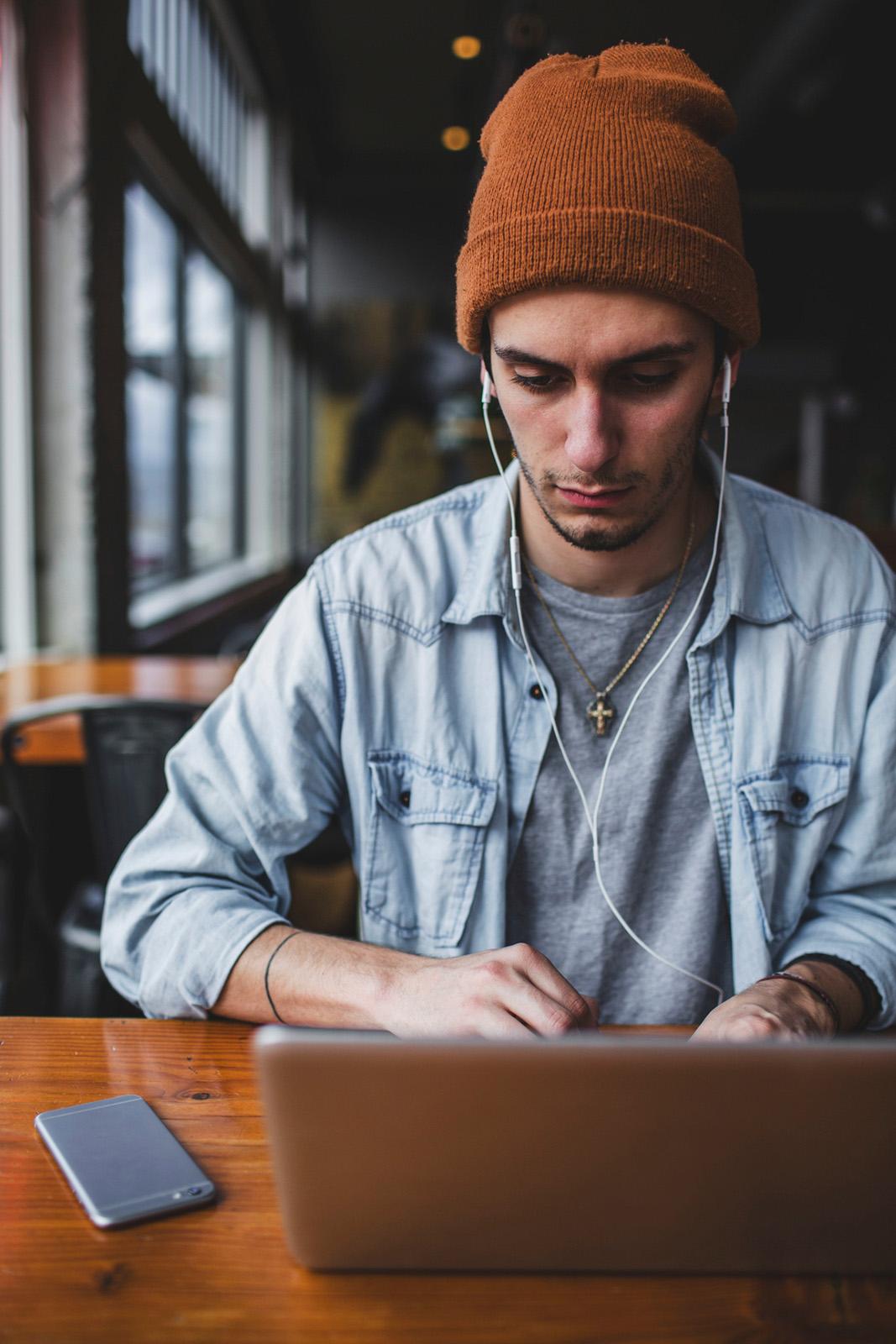 young man on a laptop in the library