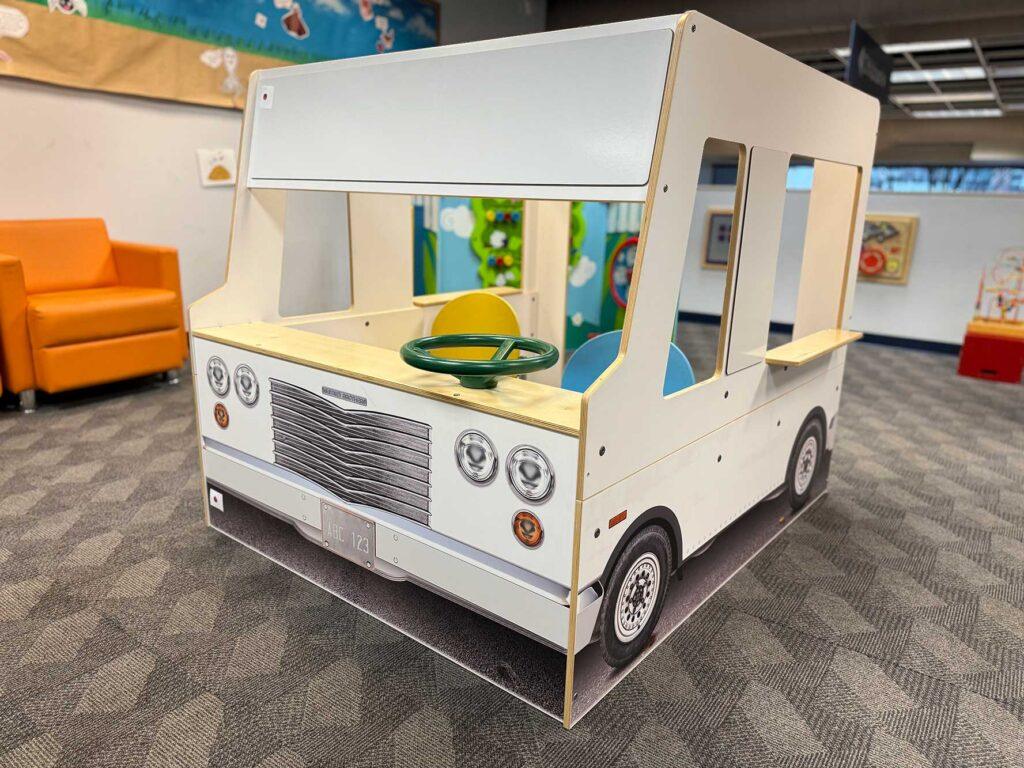 Play bus cutout structure in childrens department of central branch.