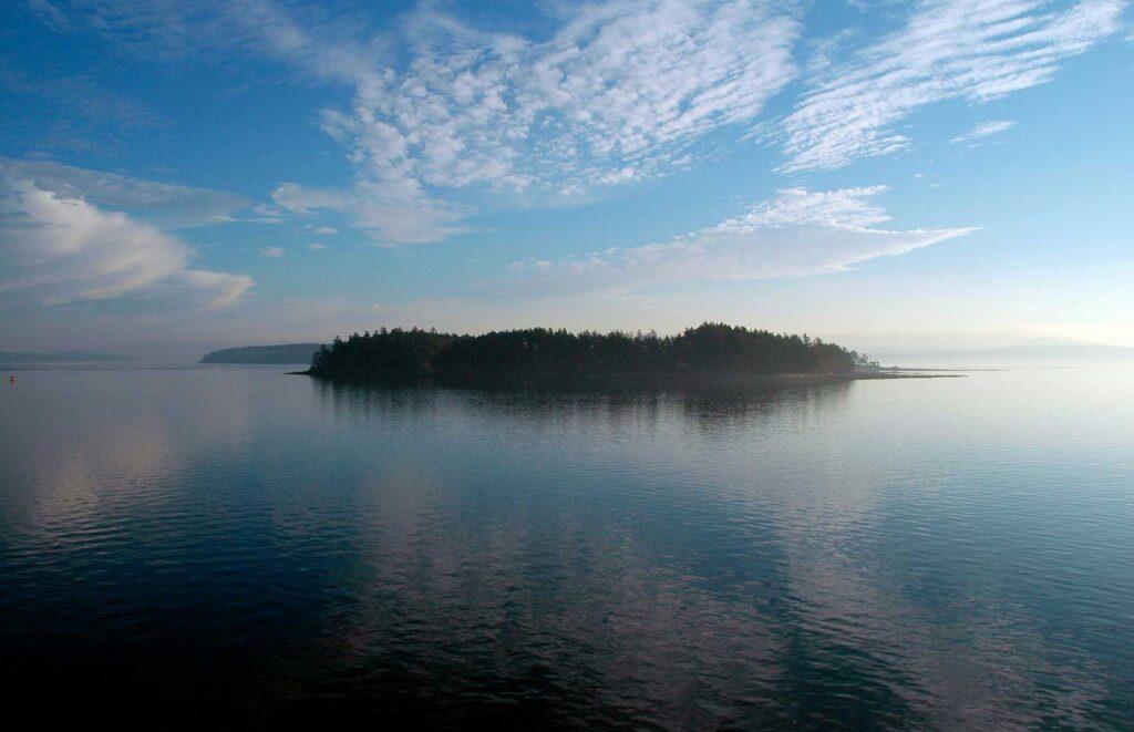 Coastal scene of solidary island on the ocean.