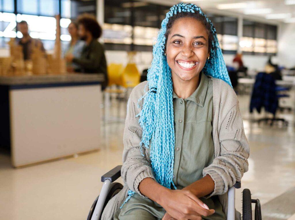 Young smiling woman in wheelchair.
