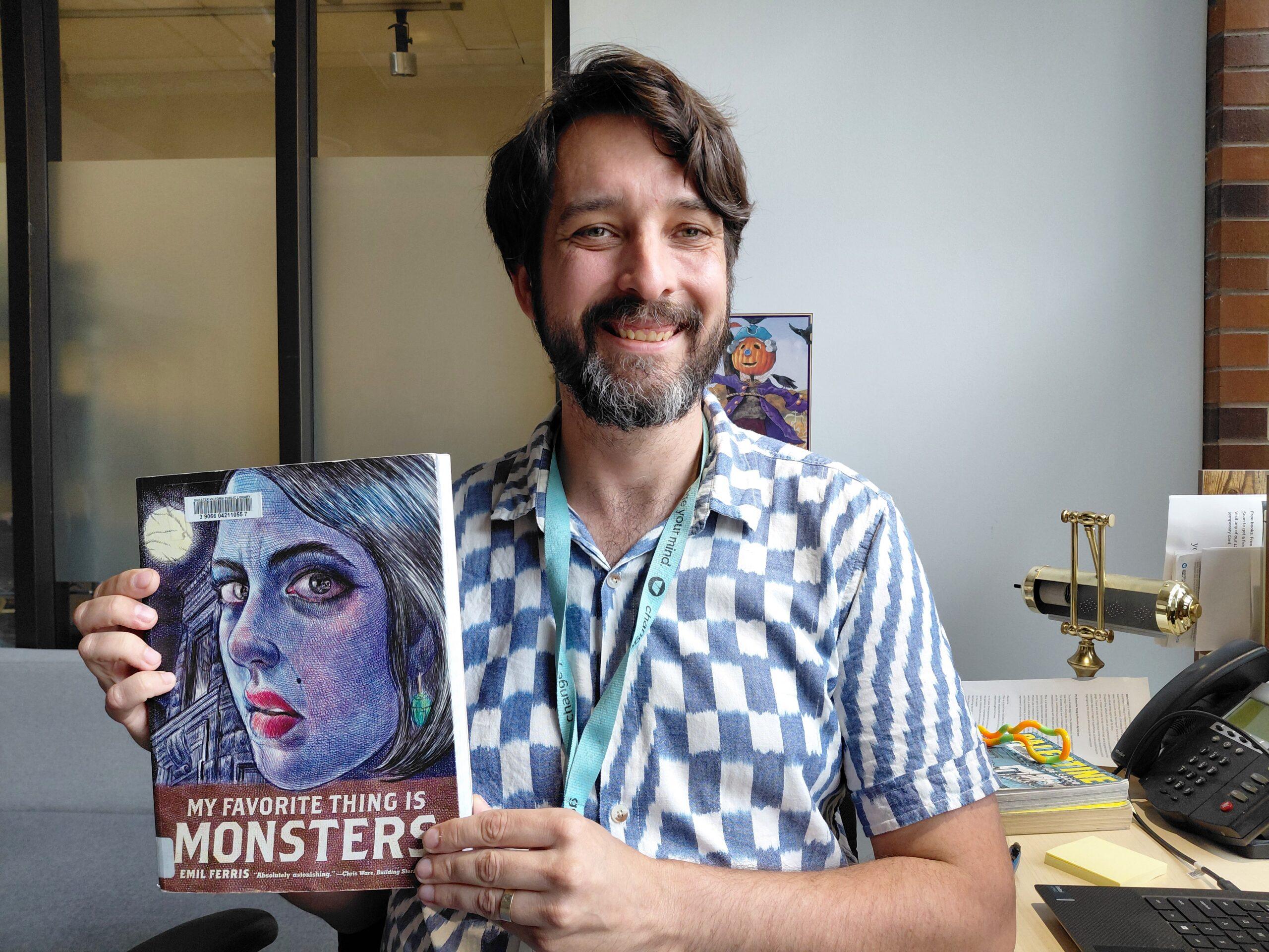 Man holding a graphic novel
